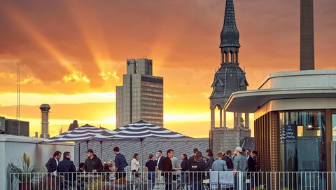 Event at sunset on the roof terrace of the Design Offices
