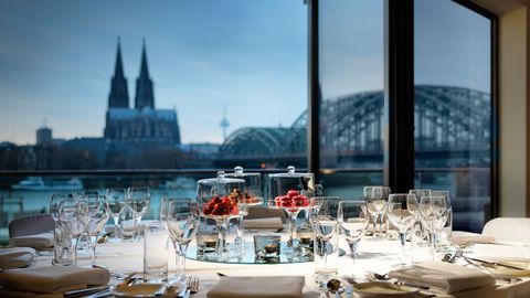 Table set at the Hyatt Regency Cologne with a view of the cathedral