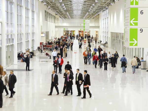 Interior view of the Koelnmesse exhibition boulevard with people walking