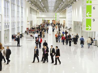 Interior view of the Koelnmesse exhibition boulevard with people walking